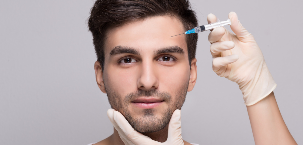 Man receiving dermal filler injection