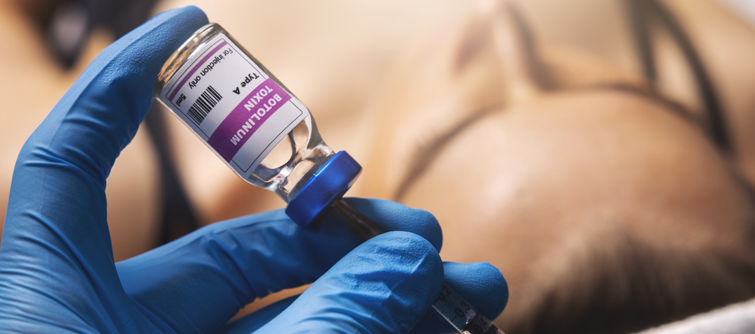 filling a syringe with botox